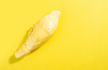 Fresh delicious durian flesh on yellow background