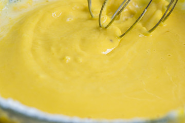 Beat the batter with a mixer, spray and flour fly