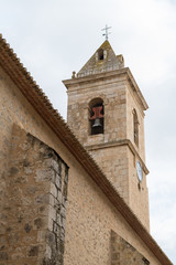 Fototapeta na wymiar Campanario de la iglesia de San Andrés, en el pueblo de Alcalá del Júcar. Albacete. Castilla La Mancha. España