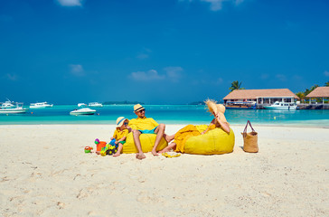 Family with three year old boy on beach