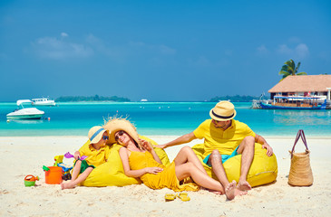 Family with three year old boy on beach