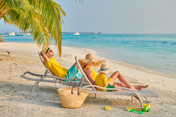 Family with three year old boy on beach