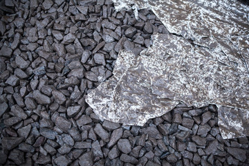 Wet crushed stones and dirty fabric