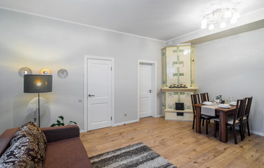 Modern studio apartment interior. Kitchen and guest room.