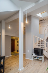 Living room in two floor apartment with TV.