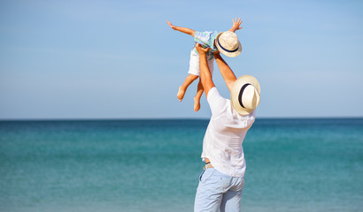 happy family father and child son at beach.