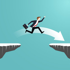 Businessman jumping over chasm of cliff go to the success