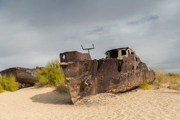 Rusty ships stranded in the sand after the Aral Sea in Uzbekistan has dried up.