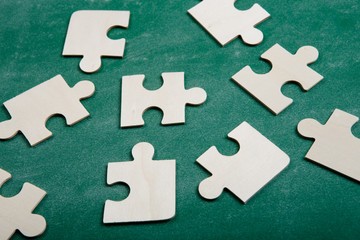Creative solution for idea - business concept, jigsaw puzzle on the blackboard