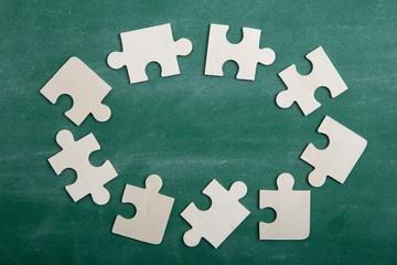 Creative solution for idea - business concept, jigsaw puzzle on the blackboard