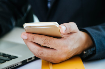 Close up of a man using mobile smart phone