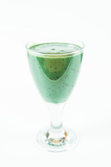 Banana and blueberry smoothie with spirulina in a glass