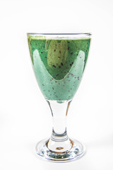 Banana and blueberry smoothie with spirulina in a glass