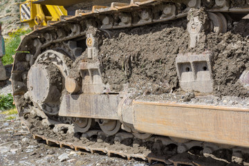 Fototapeta na wymiar bulldozer on the construction site close-up