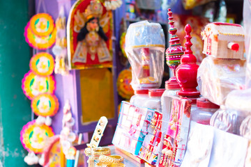 Small bells are hanging at the souvenir shop in Varanasi with a Swastika at the top that represents the positive energy. Hanging decoration items in Varanasi at the souvenir shop in Varanasi