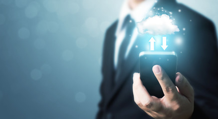 Cloud computing and technology network connection concept. Businessman hand holding mobile smart phone cloud server tranfer data device