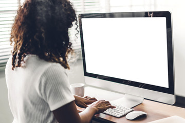 African american black woman using computer with white mockup blank screens in modern work loft