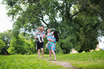 Obraz premium Mom with two daughters twins