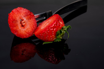 beautifully placed fresh delicious strawberries cut into two halves
