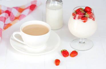 Healthy breakfast with coffee, strawberry, yogurt on white background