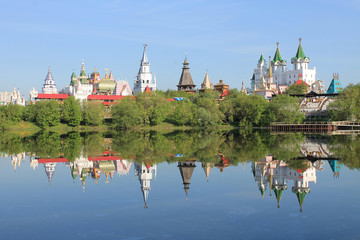 Kremlin in Izmailovo in Moscow Russia early spring morning with reflection in the blue water of the pond