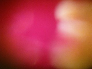 Blank film effect with a colorful light leak bokeh Real Lens Flare Easy to add as photo Overlay, Screen Filter or abstract background with light vignette. red, bright pink, yellow, orange.