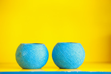 Yellow-blue background. Blue vases on yellow background