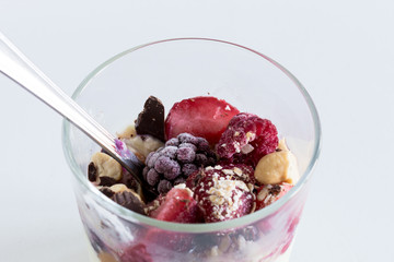 Yogurt with fresh fruits and fibers, isolated on white background