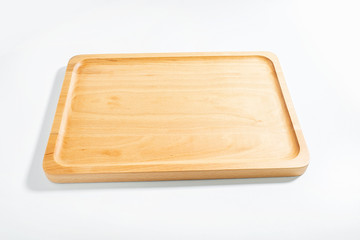 a wooden chopping board on a white background