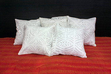 Floral pattern five linen fabric cushion covers on bed