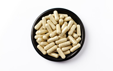 Sulforaphane capsules.  Concept for a healthy dietary supplementation. White background. Top view....