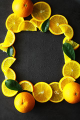 Orange citrus fruit on a stone table. Orange background.