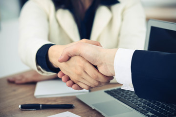 Obraz premium Business people shaking hands at meeting or negotiation in the office. Handshake concept. Partners are satisfied because signing contract
