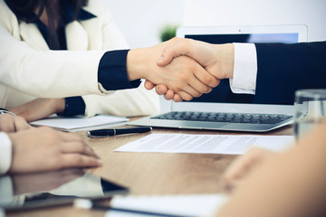 Business people shaking hands at meeting or negotiation in the office. Handshake concept. Partners are satisfied because signing contract