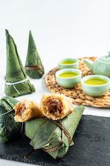 Chinese Dragon Boat Festival traditional food, tea, eating dumplings