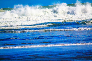 Waves crash ashore at Bethels Beach