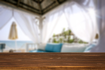 Table background of free space and beach lodge window 
