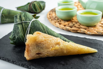 Chinese Dragon Boat Festival traditional food, tea, eating dumplings