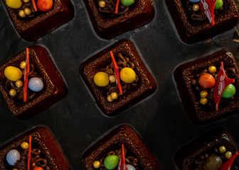 Chocolate mini cakes on display. Delicious Desserts in Buffet Line.