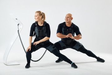 young strong people doing side forward lunge. isolated white background. pleasant time with family.