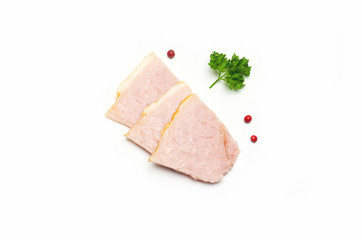 cut pieces of ham near parsley leaves and pepper red peas