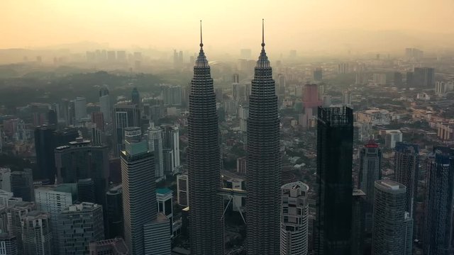 Drone Aerial view 4k Footage of Kuala Lumpur city skyline on sunset in Malaysia.