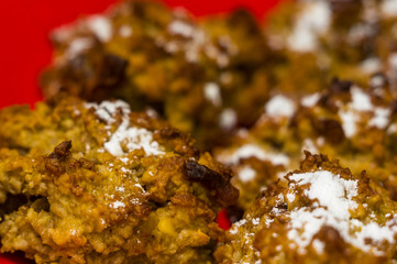 homemade oatmeal cookies with coconut, dates and powdered sugar