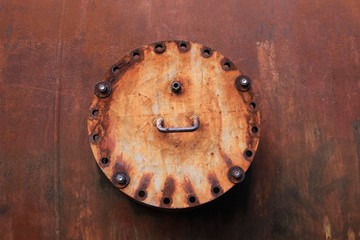 Landschaftspark Duisburg, Germany: Close up of isolated round rusty weathered metal hatch cover on...