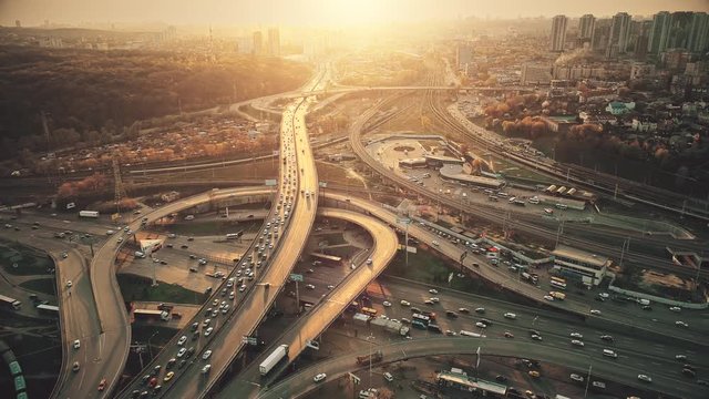 City Road System with Sight Traffic Jam Aerial View. Urban Congested Highway Lane Transport Navigation Scene. Busy Downtown Building Vehicle at Sunset. Travel Concept Drone Flight Footage 4K (UHD)