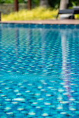 Obraz premium Swimming pool in a hotel With clear and clean blue good looking and reflecting water in the morning.