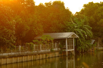 Pavilion and house near the canal in the morning.