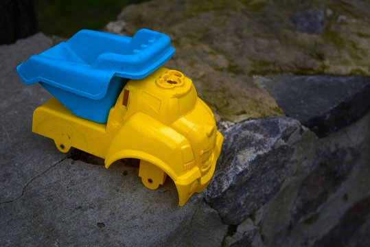 broken and discarded toy truck