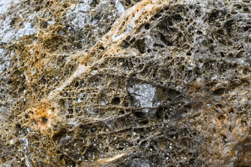 Rock texture and surface background. Cracked and weathered natural stone background.