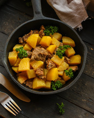 stewed potatoes with meat (goulash with vegetables). food background. top 